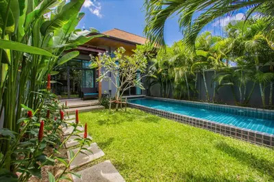 a swimming pool in the yard of a house at VILLA Emere Private Pool Nai Harn beach in Nai Harn Beach