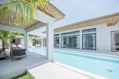 an image of a house with a swimming pool at Mouana Breeze Mai Khao 5-bedroom Pool Villa 9914 in Mai Khao Beach