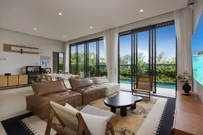 a living room with a couch and a table at Chalong Bay View 3BR Pool Villa Long One A4 in Chalong