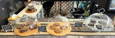 a display of different types of pastries in glass domes at Cocoon Talya Hotel in Patong Beach