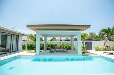 a swimming pool in the backyard of a villa at Mouana Breeze Mai Khao VIP 4-bedroom Pool Villa 9913 in Mai Khao Beach