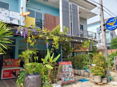 a store with plants and a sign in front of it at Katika Home 2 in Ban Khlong Haeng