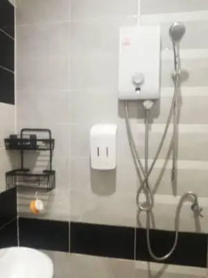 a bathroom with a blow dryer and a sink at Katika Home 2 in Ban Khlong Haeng