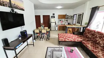 a living room with a couch and a table at Rawai Naiharn 3 bedroom house in Rawai Beach