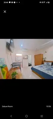 a picture of a bedroom with two beds at The Grove Guesthouse in Patong Beach