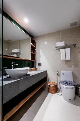 a bathroom with a sink and a toilet at Beachfront 2-bd apartment Laguna in Bang Tao Beach