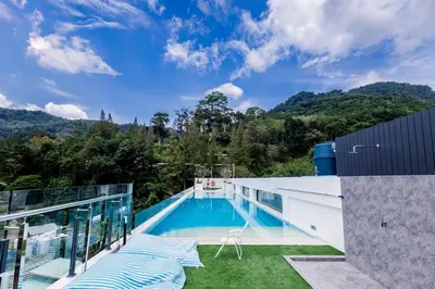 a swimming pool on the roof of a house at 1-bd apartment on Kamala beach in Kamala Beach