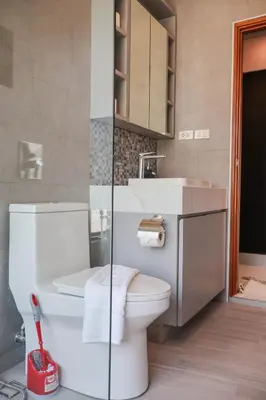 a bathroom with a toilet and a sink at Rawai Duplex Style Luxurious 4-BR Private Pool Villa in Rawai Beach