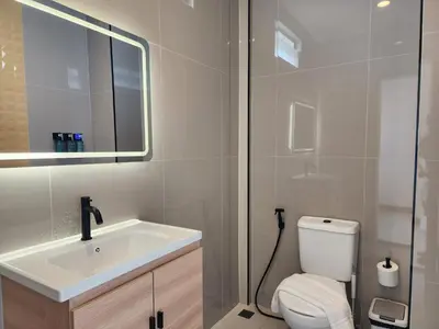 a bathroom with a sink and a toilet at Wink City 2 Patong Center close to the Beach in Patong Beach