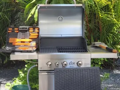a grill with a bunch of knives on top of it at Villa 320m2 Piscine privée 4 chambres à Kamala in Kamala Beach