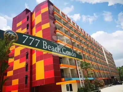 a colorful building with a sign that reads beach club at Lovely Mai Khao studio room in Mai Khao Beach