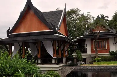 a house with a roof with a pool in front of it at Salika Luxury 5.5 Bed Villa Seaview With Maids in Rawai Beach