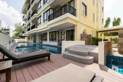 a house with a swimming pool and a building at The Lago by Villacarte in Rawai Beach