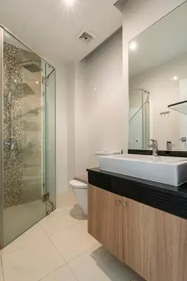 a bathroom with a sink and a toilet and a shower at The Lago by Villacarte in Rawai Beach