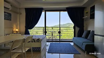 a room with a bed and a couch and a window at СС619 Романтика, чудесный вид и домашний уют in Mai Khao Beach