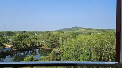 a view of a river with trees and a bridge at СС619 Романтика, чудесный вид и домашний уют in Mai Khao Beach