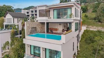 an aerial view of a white building with a swimming pool at Luxury Seaview Villa in Patong - Villa Yona in Patong Beach