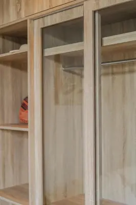 a wooden cabinet with two glass windows in it at Pangolin villa Nai Thon Beach in Nai Thon Beach