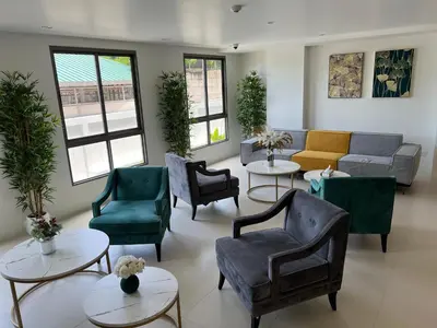 a waiting room with couches and chairs and tables at FANTASEA KAMALA NEW 1 BEDROOM & Living Room Balcony in Kamala Beach