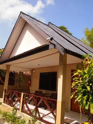 a small house with a table and a roof at Paradise Resort Phi Phi in Phi Phi Don