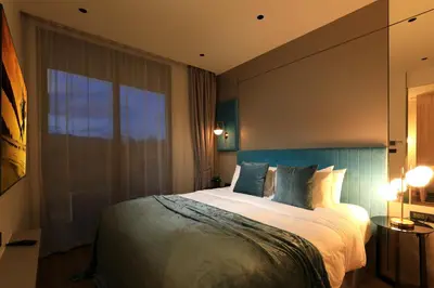 a bedroom with a large bed and a large window at New 1 bdr Apartment near Layan beach C610 in Ko Kala