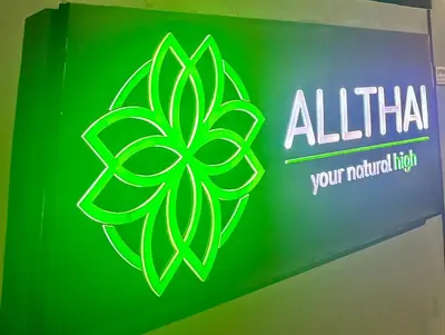 a green sign with a leaf clover on it at 1 bedroom Naiharn Beach Condo in Rawai Beach
