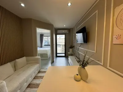 a living room with a couch and a table at Condo for rent chalong rawai 305 in Ban Klang