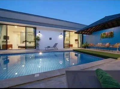 a swimming pool in the backyard of a house at The COZY NATURE pool villas phuket in Koh Lone