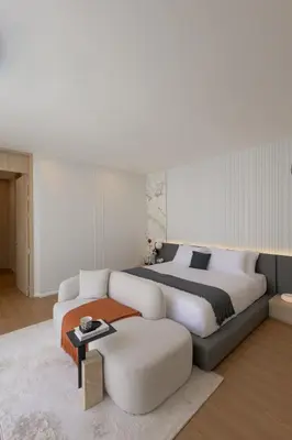 a bedroom with a large bed and a white couch at Le Da Villas 5BR Private Pool Villa, Bangtao Beach Phuket in Laguna Phuket