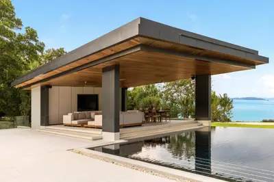 a pavilion with a television and a pool at Villa Amarasara in Phuket Town
