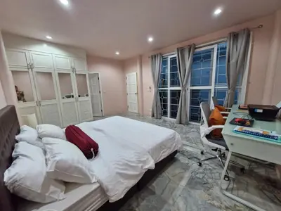 a bedroom with a large bed and a desk and a desk at Superb 3 Bed Pool Villa in Ban Saiyuan (1)