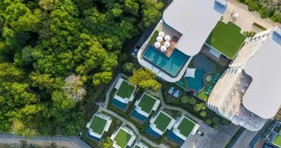 an overhead view of a yard with a house and trees at Utopia Phuket Naiharn Beach Grand Resort & Spa in Rawai Beach
