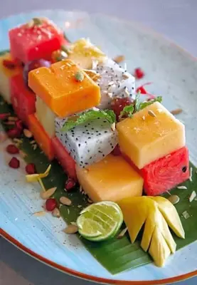 a plate of different types of cheeses and lime slices at Utopia Phuket Naiharn Beach Grand Resort & Spa in Rawai Beach