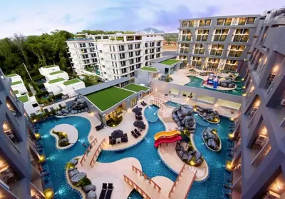 an aerial view of the water park at the resort at Utopia Phuket Naiharn Beach Grand Resort & Spa in Rawai Beach