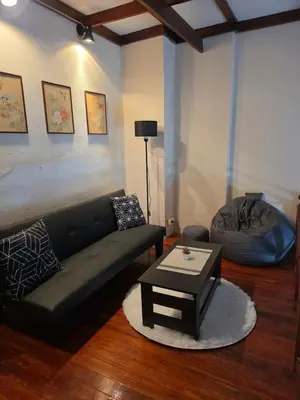 a living room with a couch and a coffee table at Monkey apartment 6 in Patong Beach