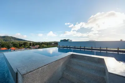 a swimming pool on top of a building at Relife Sol 2 min to Nai Harn beach by TropicLook in Rawai Beach