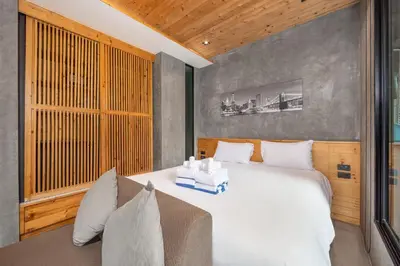 a bedroom with a large white bed and a window at Relife Sol 2 min to Nai Harn beach by TropicLook in Rawai Beach