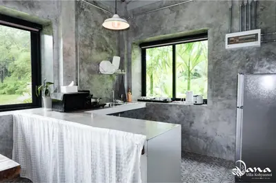 a kitchen with a white counter top in a room at Nana Villa in Ko Yao Noi