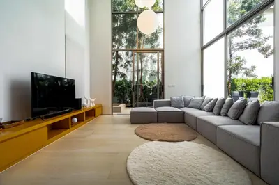 a living room with a couch and a tv at Luxpride Villa by Wallaya Villas in Ban Thalat Choeng Thale