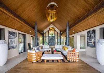 a living room with a couch and a table at Villa Amaravida in Ko Lek