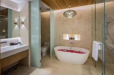 a bathroom with a tub and a sink at Villa Amaravida in Ko Lek