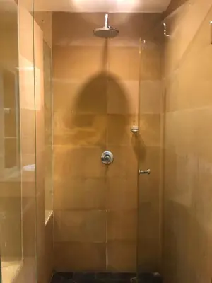 a shower with a glass door in a bathroom at Bel Air Panwa Big Apartment in south Phuket near Ao Yon Beach, 3rd floor in Ban Ao Makham
