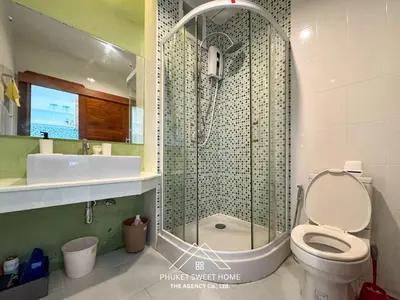 a bathroom with a shower with a toilet and a sink at Condo fodr rent The bell 50 in Ban Klang