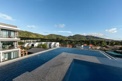a swimming pool on the roof of a building at Relife Rio 2 min to Nai Harn beach in Rawai Beach