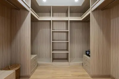 a walk in closet with wooden walls and a ceiling at Golden Cotton Villa 3BR Lagoon View by GRF in Laguna Phuket