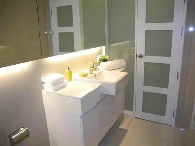 a white bathroom with a sink and a mirror at Ideally Apartment close to Kata Beach in Kata Beach