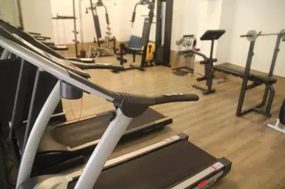 a gym with several exercise bikes and a treadmill at Sea Breeze Patong Holiday Condo in Patong Beach