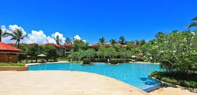 a swimming pool in front of a resort at Tropical Holiday Home at Laguna Phuket in Layan Beach