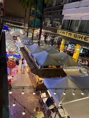 a group of blue tents on a city street at Mamma Mia Rooms in Kata Beach