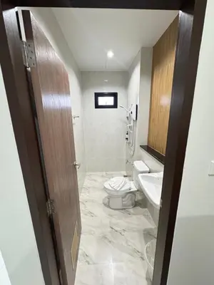 a bathroom with a toilet and a sink at Lela Home in Phuket Town